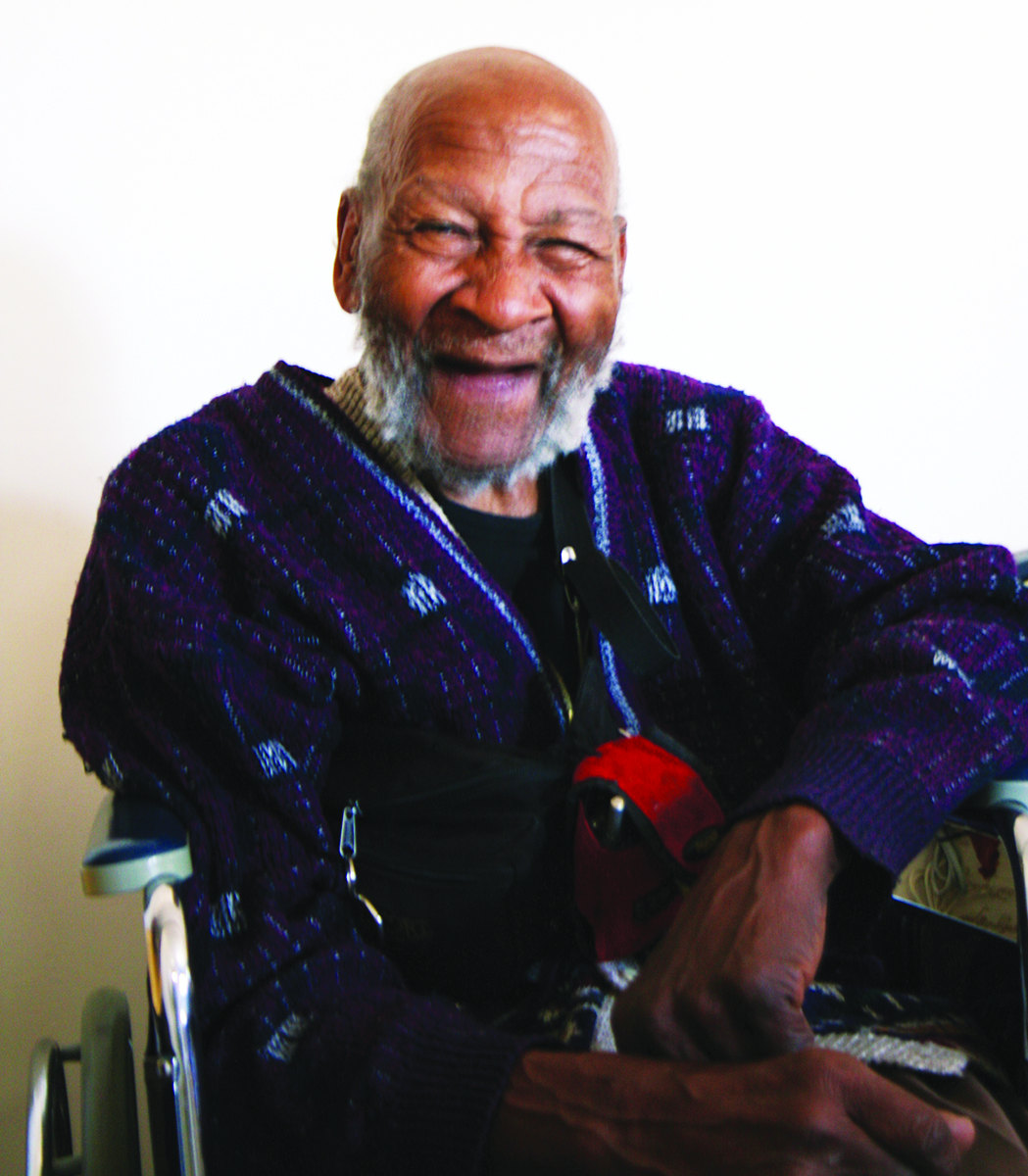 Smiling participant in wheelchair